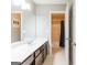 Bathroom featuring a double vanity, a large mirror, and a separate shower and toilet area for added privacy at 1144 Simonton Hill Ct, Lawrenceville, GA 30045