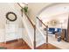 Inviting foyer with a staircase, hardwood floors, and a view into the stylish living room at 1144 Simonton Hill Ct, Lawrenceville, GA 30045