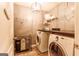Well-organized laundry room with washer, dryer, ample shelving, and a convenient folding area at 1144 Simonton Hill Ct, Lawrenceville, GA 30045