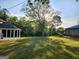 Large backyard with mature trees and a charming swing set at 3581 S Hwy 100, Bowdon, GA 30108
