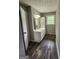 Bathroom showcasing wood-look floors, a white vanity and natural light at 3581 S Hwy 100, Bowdon, GA 30108
