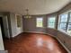 Bright dining room featuring hardwood floors and elegant lighting at 3581 S Hwy 100, Bowdon, GA 30108