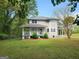 Inviting home featuring a charming front porch and well-maintained lawn at 3581 S Hwy 100, Bowdon, GA 30108
