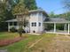 Charming home featuring an attached carport and well-manicured landscaping at 3581 S Hwy 100, Bowdon, GA 30108