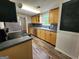 The kitchen showcases stainless appliances and wood cabinets, providing ample storage at 3581 S Hwy 100, Bowdon, GA 30108