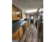 Kitchen features stainless steel appliances, wood cabinets, and a window over the sink at 3581 S Hwy 100, Bowdon, GA 30108