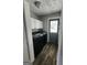 Clean laundry area with modern washer/dryer and white cabinets at 3581 S Hwy 100, Bowdon, GA 30108
