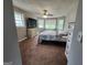 Bedroom with multiple windows, providing natural light, and plush carpeting at 3581 S Hwy 100, Bowdon, GA 30108