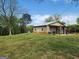 Spacious outbuilding with multiple garage doors and a covered porch at 3581 S Hwy 100, Bowdon, GA 30108