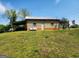 Versatile outbuilding with covered parking and an American flag display at 3581 S Hwy 100, Bowdon, GA 30108
