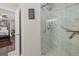 Contemporary bathroom with glass-enclosed shower and access to the main bedroom at 6324 Amberly Rd, Rex, GA 30273