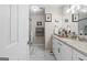 Updated bathroom featuring a glass-enclosed shower, updated vanity, and marble-look tile floor at 6324 Amberly Rd, Rex, GA 30273