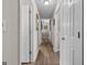 Hallway view featuring wood floors and paneled doors leading to other rooms at 6324 Amberly Rd, Rex, GA 30273