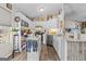Updated kitchen with white cabinets, stainless appliances, and island with breakfast bar at 6324 Amberly Rd, Rex, GA 30273