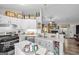 Modern kitchen with white cabinets, granite counters, stainless appliances, and breakfast bar at 6324 Amberly Rd, Rex, GA 30273