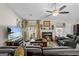 Comfortable living room featuring a fireplace, hardwood floors, and ample natural light, creating a relaxing space at 6324 Amberly Rd, Rex, GA 30273