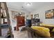 Home office featuring wood-look floors, and neutral walls, with a sofa for relaxing at 6324 Amberly Rd, Rex, GA 30273