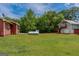 Large propane tank in the backyard of a red and gray home at 1170 Peeksville Rd, Locust Grove, GA 30248