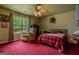 Inviting bedroom with bright window and carpet flooring at 1170 Peeksville Rd, Locust Grove, GA 30248