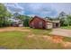 Exterior view features the home, garage, and vast lawn, showcasing curb appeal and outdoor space at 1170 Peeksville Rd, Locust Grove, GA 30248