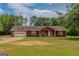 Charming single-Gathering home with a well-maintained lawn and attached garage at 1170 Peeksville Rd, Locust Grove, GA 30248