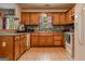 Functional kitchen with wooden cabinets and tile flooring at 1170 Peeksville Rd, Locust Grove, GA 30248