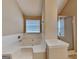 Bright bathroom with a soaking tub and separate glass-enclosed shower at 4140 Butternut Pl, South Fulton, GA 30349