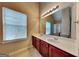 Bathroom featuring double sink vanity and a large mirror at 4140 Butternut Pl, South Fulton, GA 30349