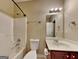Bathroom with shower and vanity with a decorative mirror at 4140 Butternut Pl, South Fulton, GA 30349