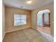 Cozy bedroom with neutral carpet and a large window with natural light at 4140 Butternut Pl, South Fulton, GA 30349