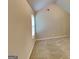 Neutral carpeted bedroom with high ceilings and natural light at 4140 Butternut Pl, South Fulton, GA 30349