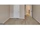 Neutral hallway with carpeted floor and white doors at 4140 Butternut Pl, South Fulton, GA 30349