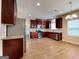 Modern kitchen with stainless steel appliances, granite countertops, and wooden cabinets at 4140 Butternut Pl, South Fulton, GA 30349