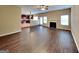 Spacious living room with fireplace, hardwood floors, and access to kitchen at 4140 Butternut Pl, South Fulton, GA 30349