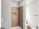 Bathroom shower with tiled wall and built-in niche at 209 Langshire Dr, Mcdonough, GA 30253