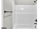 Clean bathroom with shower featuring a black shower head and towel rack at 209 Langshire Dr, Mcdonough, GA 30253