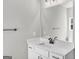 Bright bathroom with a white vanity cabinet, countertop, and black fixtures at 209 Langshire Dr, Mcdonough, GA 30253