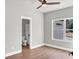 Light-filled bedroom showing attached bathroom with white cabinets at 209 Langshire Dr, Mcdonough, GA 30253