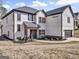 A well-maintained, two-story home with a white brick facade and a neatly landscaped front yard at 209 Langshire Dr, Mcdonough, GA 30253