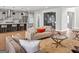 A spacious living room with an open layout, leading to the kitchen and dining area at 209 Langshire Dr, Mcdonough, GA 30253