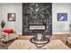 Elegant living room featuring a marble fireplace, comfortable seating, and a stylish coffee table at 209 Langshire Dr, Mcdonough, GA 30253