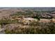 Aerial image of 79 Turner Dr amongst the treetops, showcasing pond and tranquil surroundings at 79 Turner Dr, Mcdonough, GA 30252