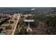 Stunning view of 79 Turner Dr nestled among trees and fronting a picturesque pond at 79 Turner Dr, Mcdonough, GA 30252
