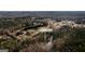 Aerial shot of 79 Turner Dr, showing surrounding woods and a charming pond at 79 Turner Dr, Mcdonough, GA 30252