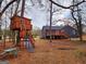 Backyard with home, wood deck, a play set and a wooden tree house at 79 Turner Dr, Mcdonough, GA 30252