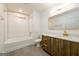 Modern bathroom with sleek vanity, stylish mirror, and shower-tub combination at 79 Turner Dr, Mcdonough, GA 30252