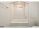 Bright bathroom with a shower and bath combo featuring modern white tile at 79 Turner Dr, Mcdonough, GA 30252