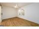 Bedroom with hardwood floors, ceiling fan, window with blinds, and sliding closet door at 79 Turner Dr, Mcdonough, GA 30252