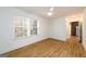 Bright bedroom with hardwood floors, ceiling fan, and double windows at 79 Turner Dr, Mcdonough, GA 30252