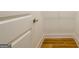 Small walk-in closet with shelving, neutral paint, and wood-look floor at 79 Turner Dr, Mcdonough, GA 30252
